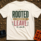 Rooted Yet Roaming - T-Shirt in Ivory - A typographic design reading "ROOTED ENOUGH TO LEAVE" with roots drawn inside the...