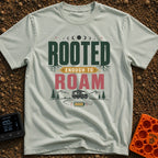 Rooted To Roam - T-Shirt in Bay - The design features the text "ROOTED ENOUGH TO ROAM" with tree roots growing from the...