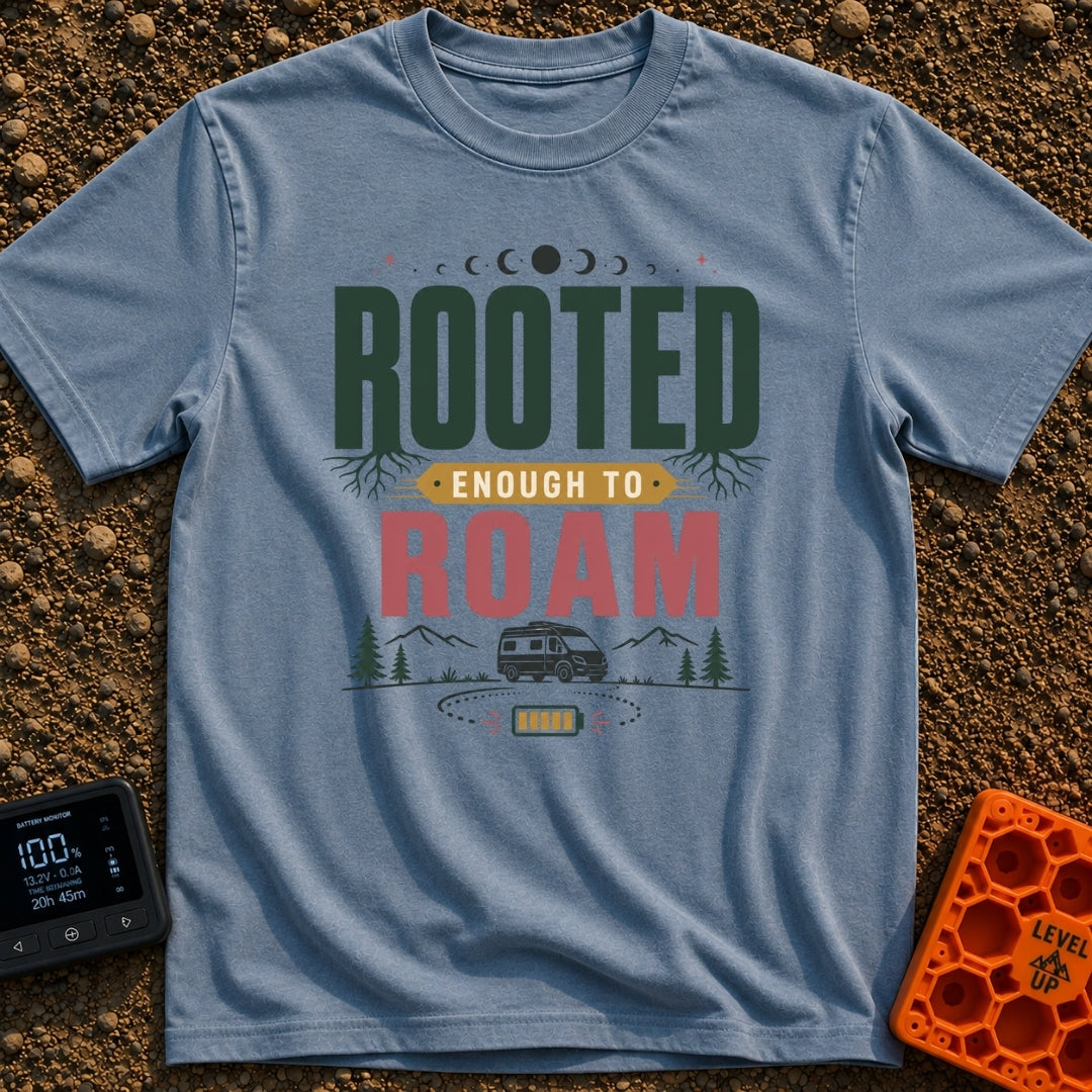 Rooted To Roam - T-Shirt in Blue Jean - The design features the text "ROOTED ENOUGH TO ROAM" with tree roots growing from...