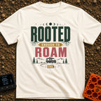 Rooted To Roam - T-Shirt in Ivory - The design features the text "ROOTED ENOUGH TO ROAM" with tree roots growing from the...