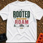 Rooted To Roam - T-Shirt in White - The design features the text "ROOTED ENOUGH TO ROAM" with tree roots growing from the...