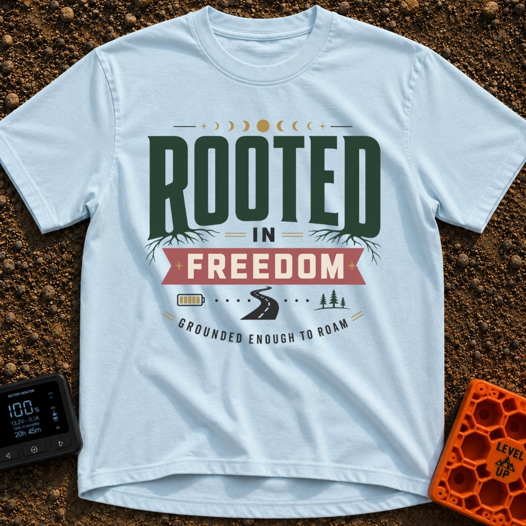 Grounded To Roam - T-Shirt in Chambray - A typographic design reading "ROOTED IN FREEDOM" with roots growing from the...