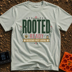 Rooted Ready Rescue Pet - T-Shirt in Bay - A typographic design featuring the words "ROOTED" and "READY" above a banner...