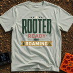 Rooted To Roam - T-Shirt in Bay - A typographic design reading "ROOTED", "READY", and "ROAMING" stacked vertically. The...