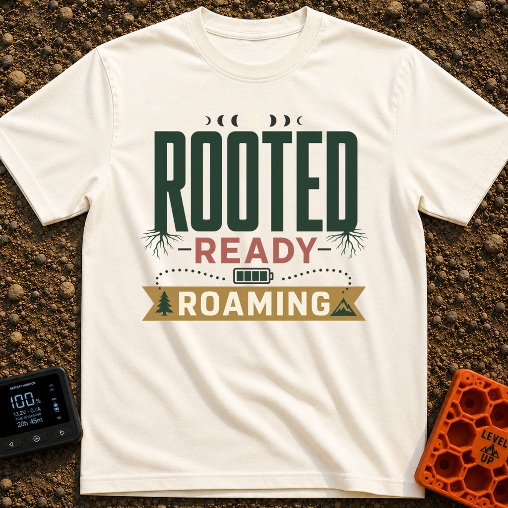 Rooted To Roam - T-Shirt in Ivory - A typographic design reading "ROOTED", "READY", and "ROAMING" stacked vertically. The...
