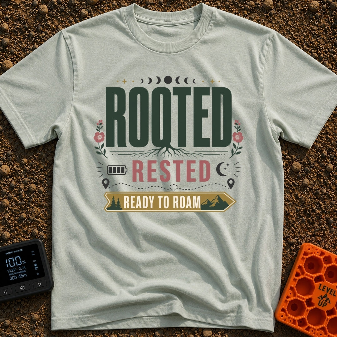 Rooted Ready To Roam - T-Shirt in Bay - A typographic design featuring the word "ROOTED" with tree roots growing from the...