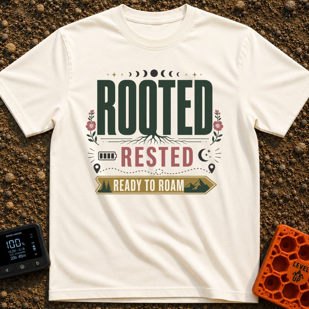 Rooted Ready To Roam - T-Shirt in Ivory - A typographic design featuring the word "ROOTED" with tree roots growing from...