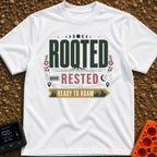 Rooted Ready To Roam - T-Shirt in White - A typographic design featuring the word "ROOTED" with tree roots growing from...