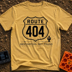 Route 404 Not Found - T-Shirt in Mustard - A black and white graphic featuring a traditional U.S. highway shield sign...