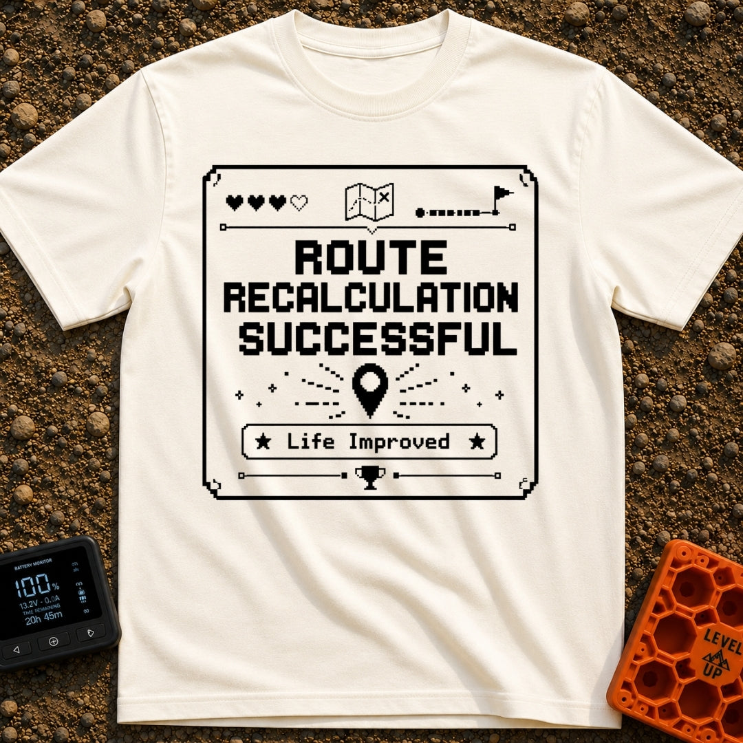 New Route Unlocked - T-Shirt in Ivory - A black and white pixel-art style graphic featuring the text "ROUTE RECALCULATION...