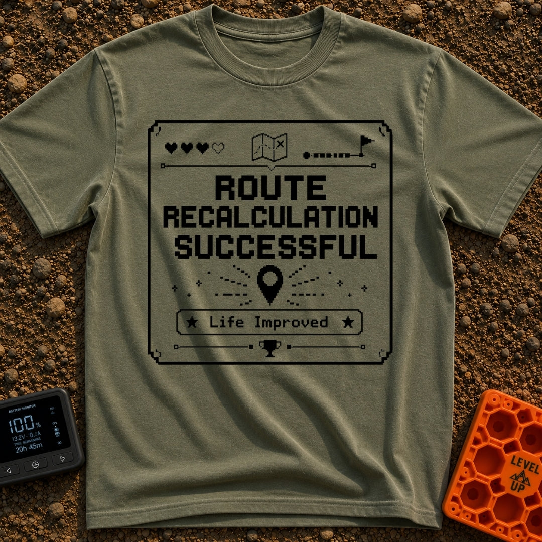 New Route Unlocked - T-Shirt in Moss - A black and white pixel-art style graphic featuring the text "ROUTE RECALCULATION...