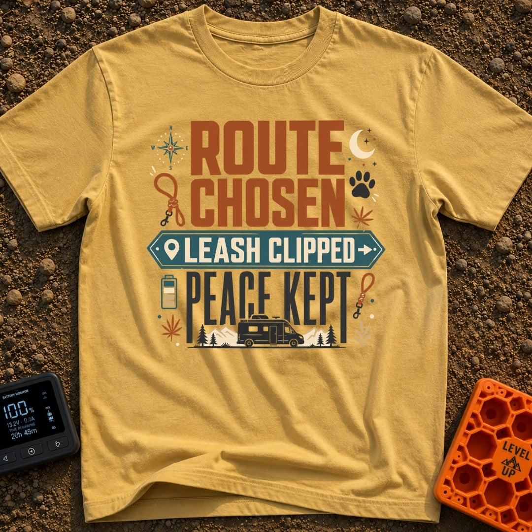 Leash Clipped Peace Kept - T-Shirt in Mustard - A typographic design reading "ROUTE CHOSEN", "LEASH CLIPPED" inside a...