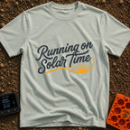 Running On Solar Time - T-Shirt in Bay - A typographical design featuring the cursive text "Running on Solar Time" in...