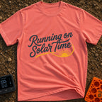 Running On Solar Time - T-Shirt in Watermelon - A typographical design featuring the cursive text "Running on Solar Time"...