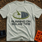 Running On Solar Time - T-Shirt in Bay - A circular graphic split down the middle, with the left side depicting a sundial...