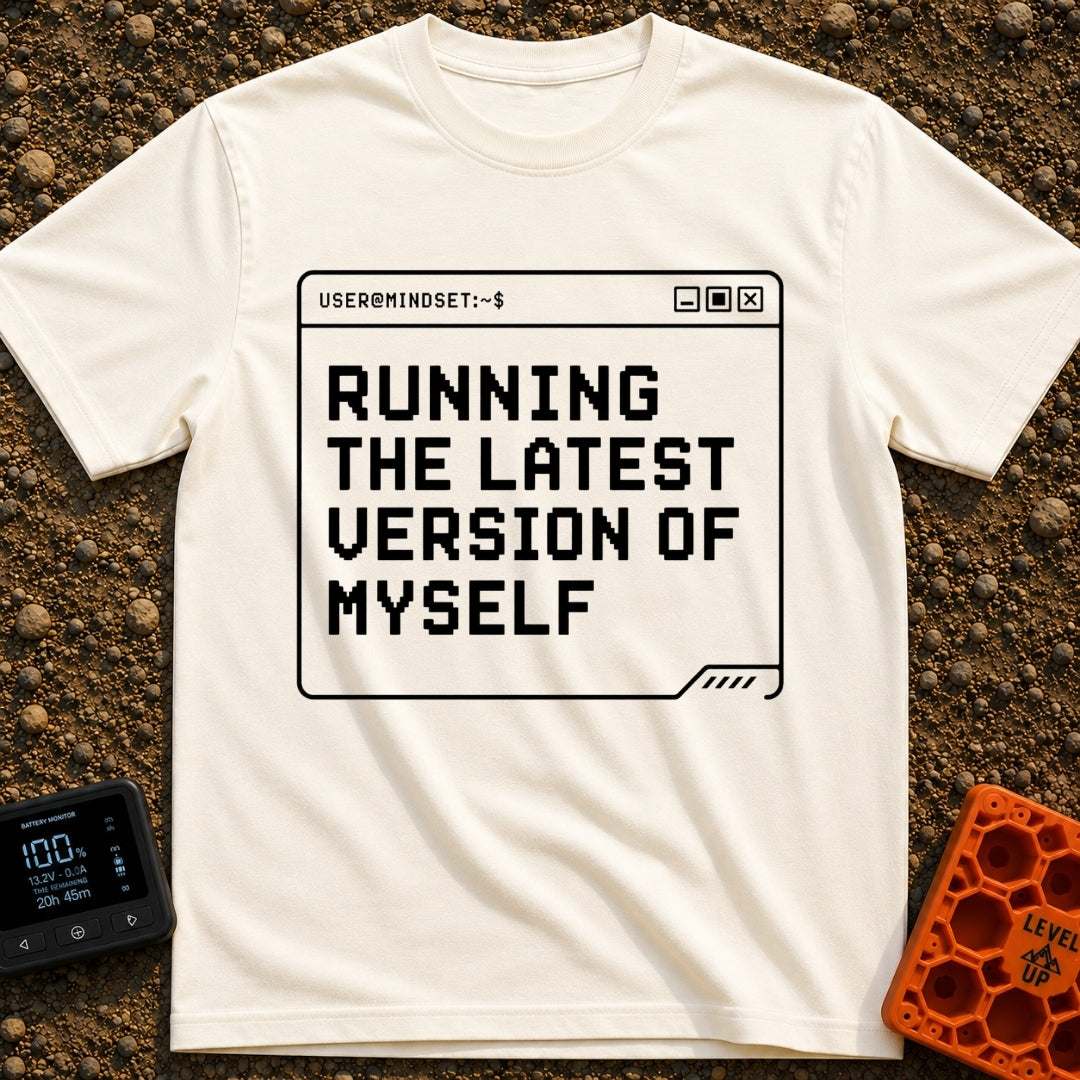 Running My Latest Version - T-Shirt in Ivory - A black-and-white graphic of a computer terminal window with the header...