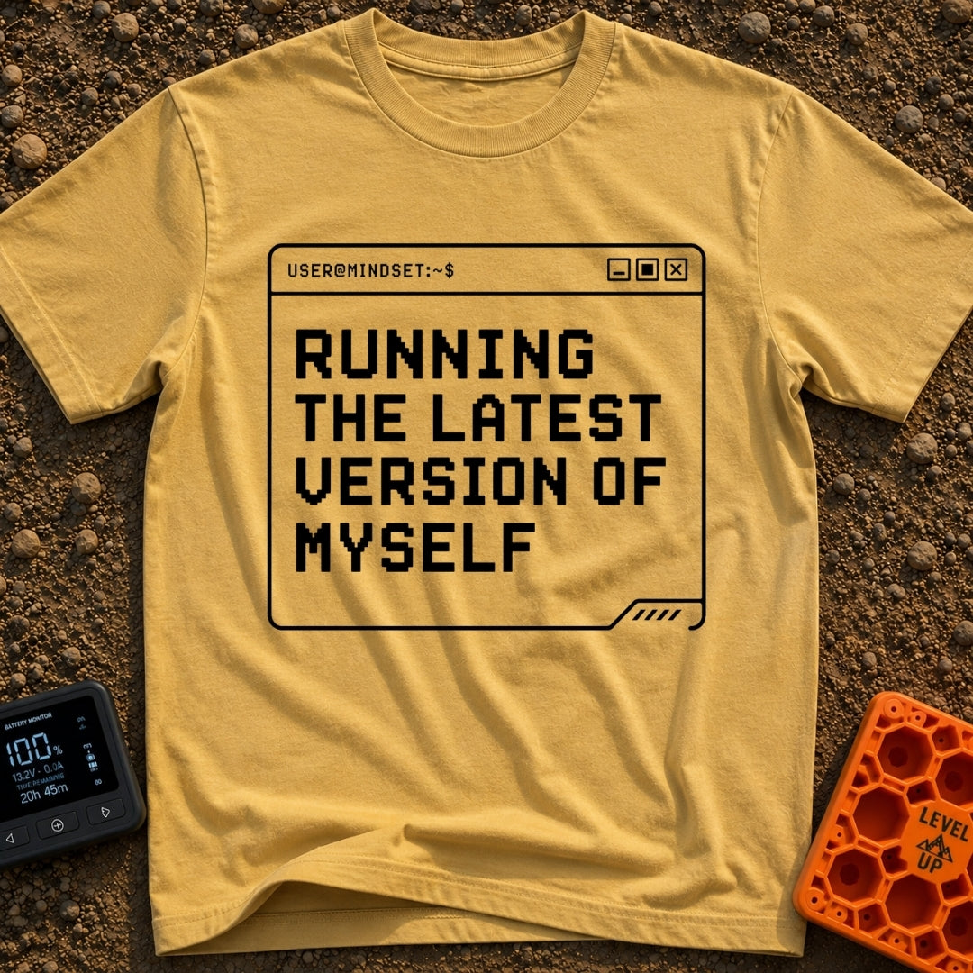 Running My Latest Version - T-Shirt in Mustard - A black-and-white graphic of a computer terminal window with the header...