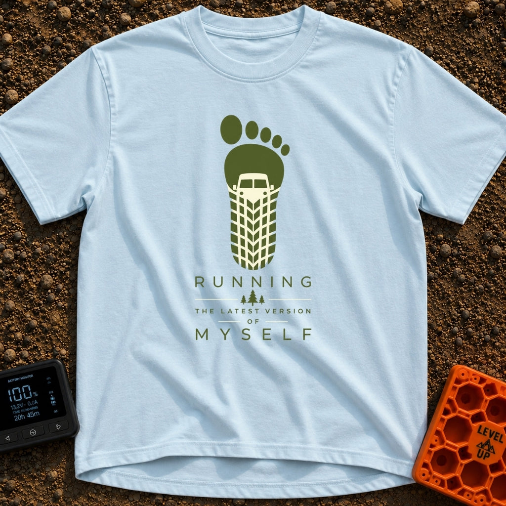 Running My Latest Version - T-Shirt in Chambray - A graphic of a green bare footprint where the heel and arch area is...