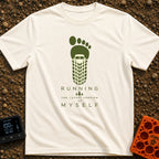 Running My Latest Version - T-Shirt in Ivory - A graphic of a green bare footprint where the heel and arch area is formed...
