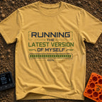 Fully Updated Me - T-Shirt in Mustard - A text-based design featuring the phrase 'RUNNING THE LATEST VERSION OF MYSELF'...