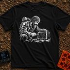 Hungry For Power - T-Shirt in Black - A black-and-white illustration of a rugged, bearded man wearing a beanie and a...
