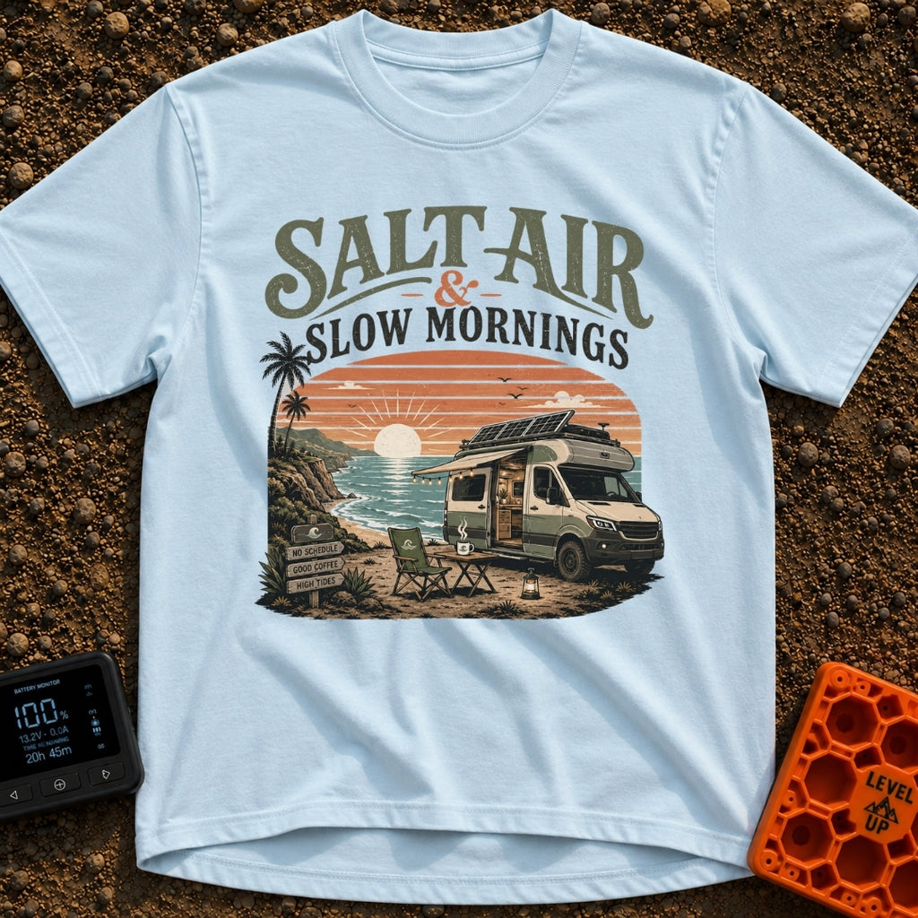 Sunrise Sips & Sea - T-Shirt in Chambray - A camper van is parked on a coastal cliff overlooking the ocean at sunrise,...