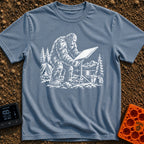 Sasquatch Seeking Signal - T-Shirt in Blue Jean - A black-and-white illustration of a Sasquatch adjusting a flat...