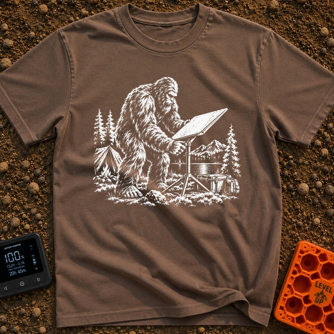 Sasquatch Seeking Signal - T-Shirt in Espresso - A black-and-white illustration of a Sasquatch adjusting a flat satellite...
