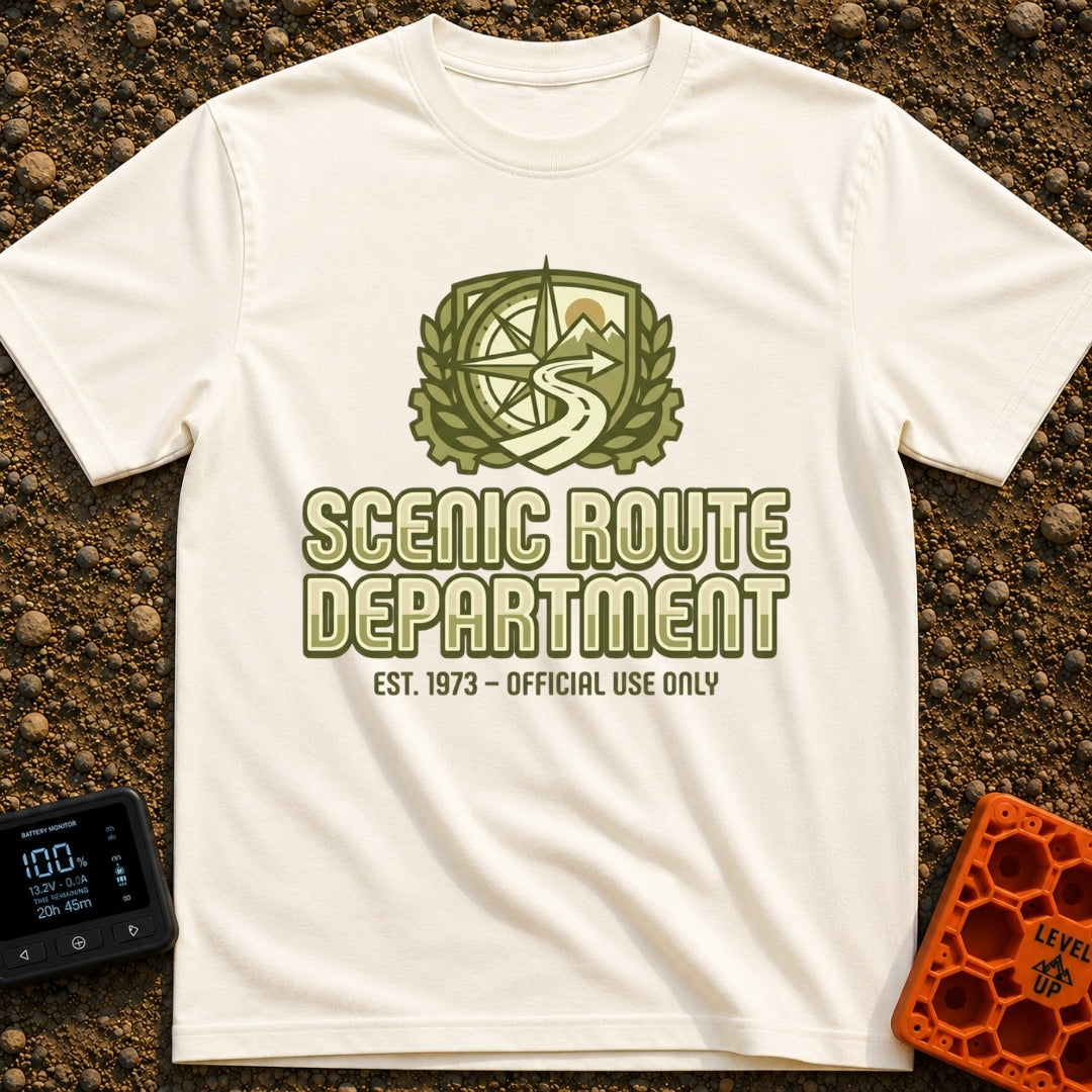 Scenic Route Authority - T-Shirt in Ivory - An olive green crest graphic featuring a compass, mountains, a sun, and a...