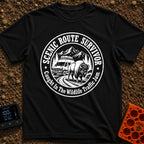 Survived The Scenic Route - T-Shirt in Black - A circular, black-and-white illustration of a camper van stopped on a dirt...