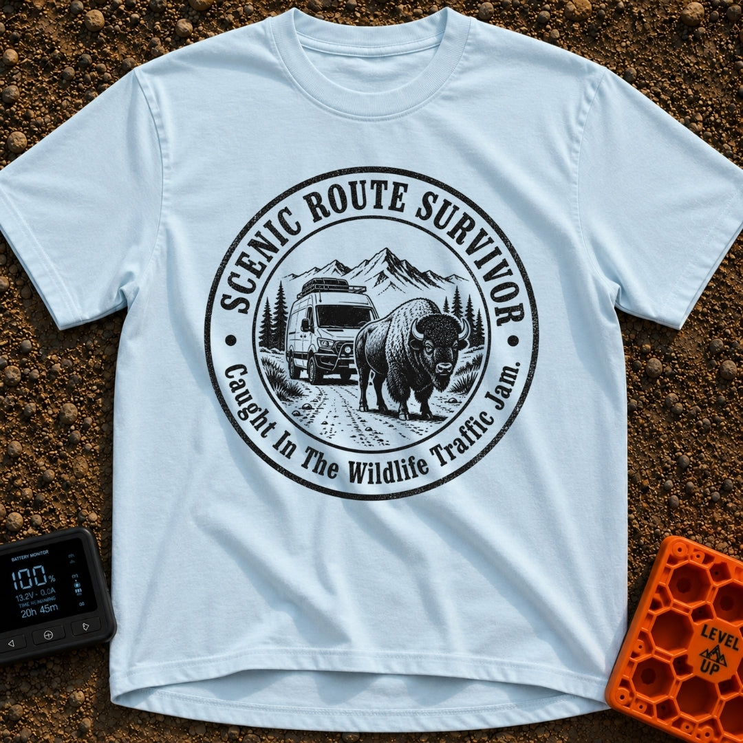 Survived The Scenic Route - T-Shirt in Chambray - A circular, black-and-white illustration of a camper van stopped on a...