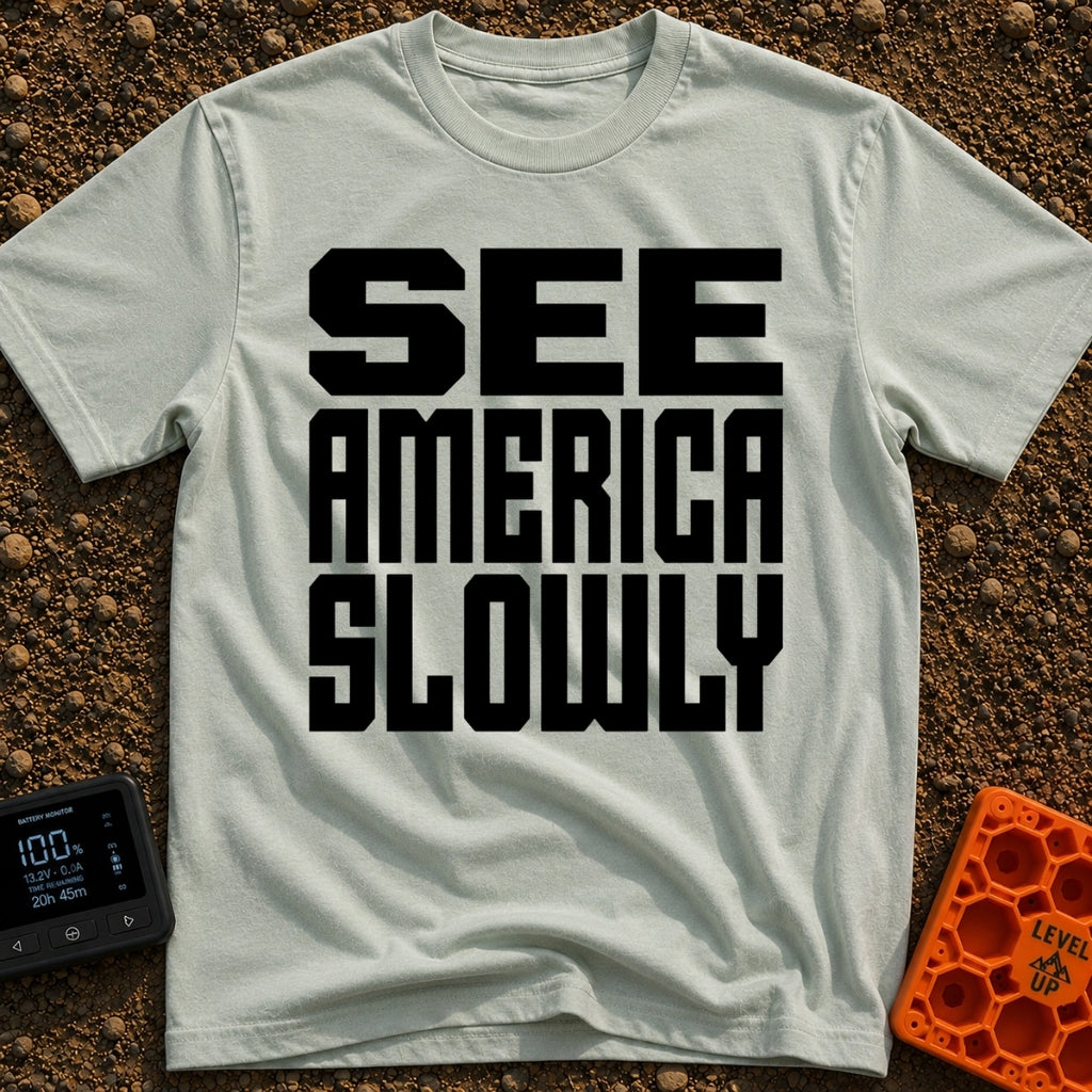 Go Slow, America - T-Shirt in Bay - Bold, black, block text stacked in three lines reading 'SEE AMERICA SLOWLY' on a...