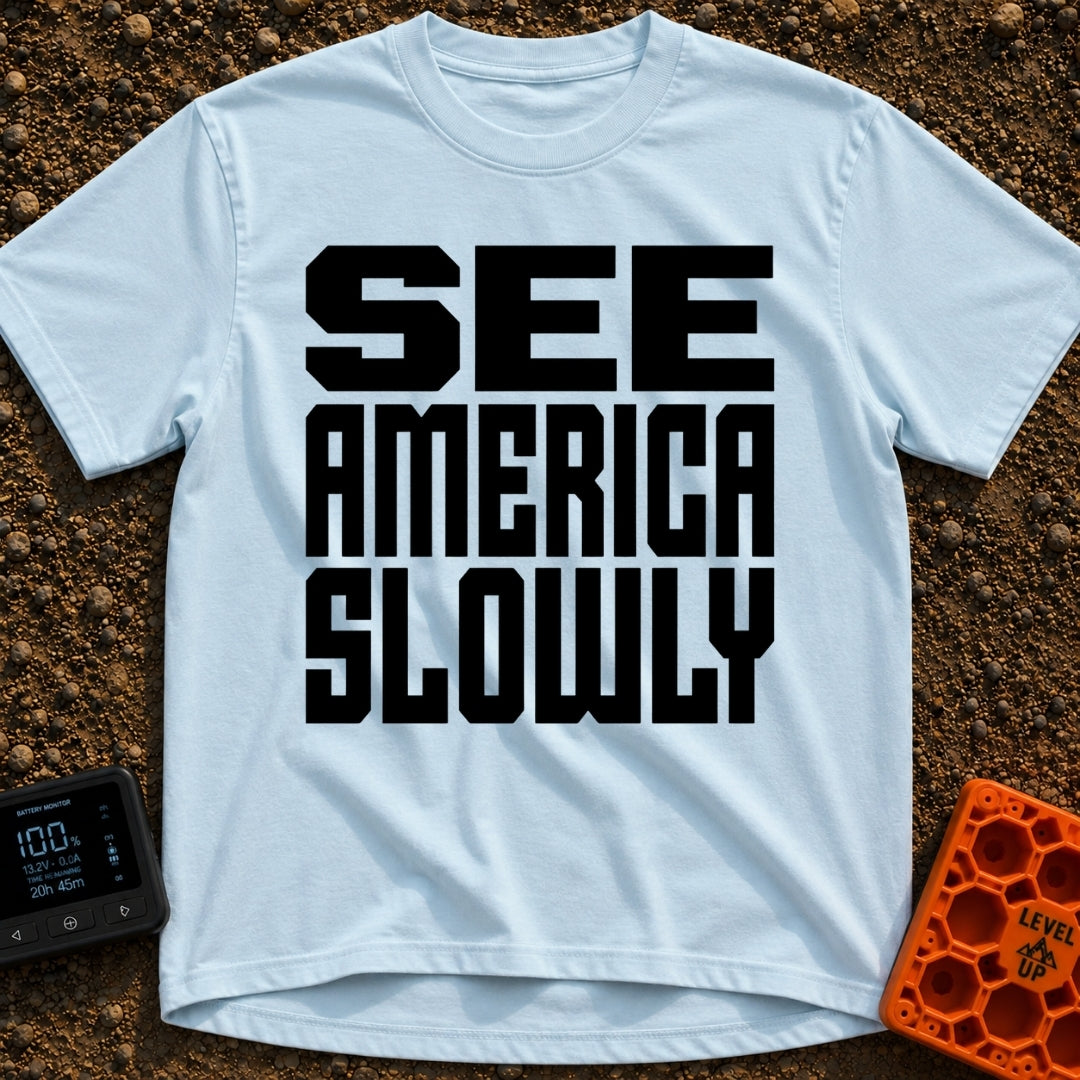 Go Slow, America - T-Shirt in Chambray - Bold, black, block text stacked in three lines reading 'SEE AMERICA SLOWLY' on a...