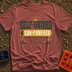 Solar Power Trip - T-Shirt in Brick - A typographic design featuring the text "SELF-GUIDED" above a yellow full-battery...