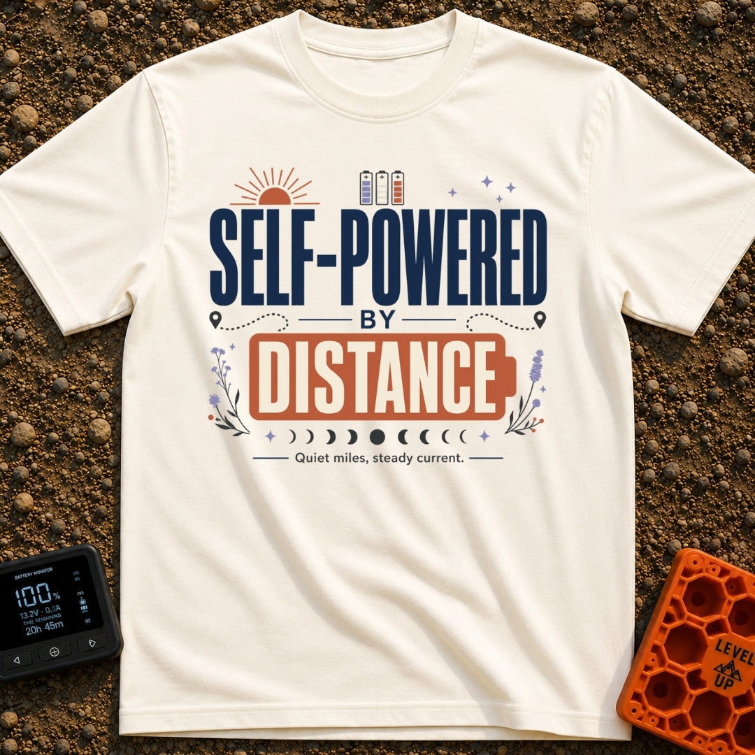 Charged By Distance - T-Shirt in Ivory - A typographic design reading "SELF-POWERED BY DISTANCE" with the word "DISTANCE"...