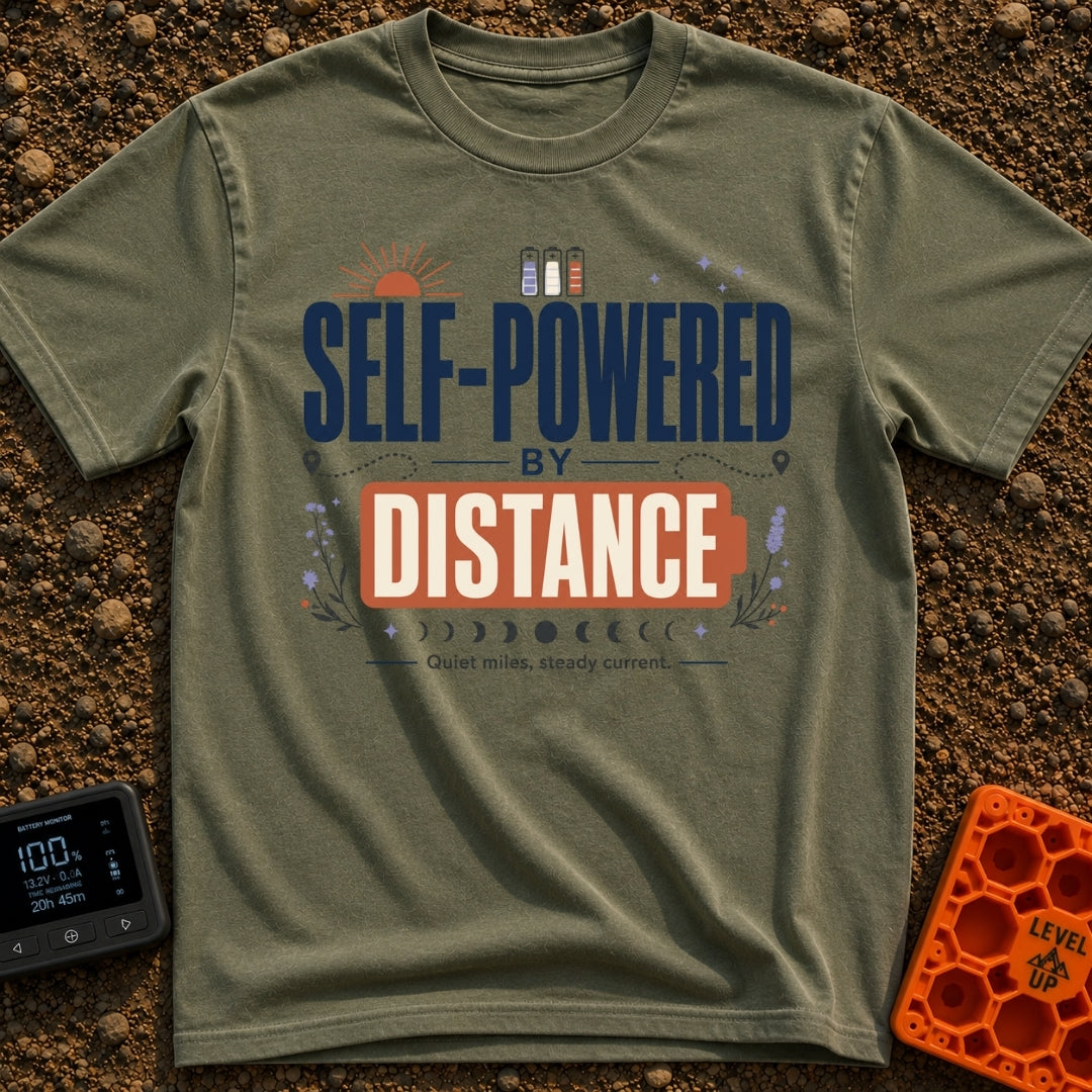 Charged By Distance - T-Shirt in Moss - A typographic design reading "SELF-POWERED BY DISTANCE" with the word "DISTANCE"...