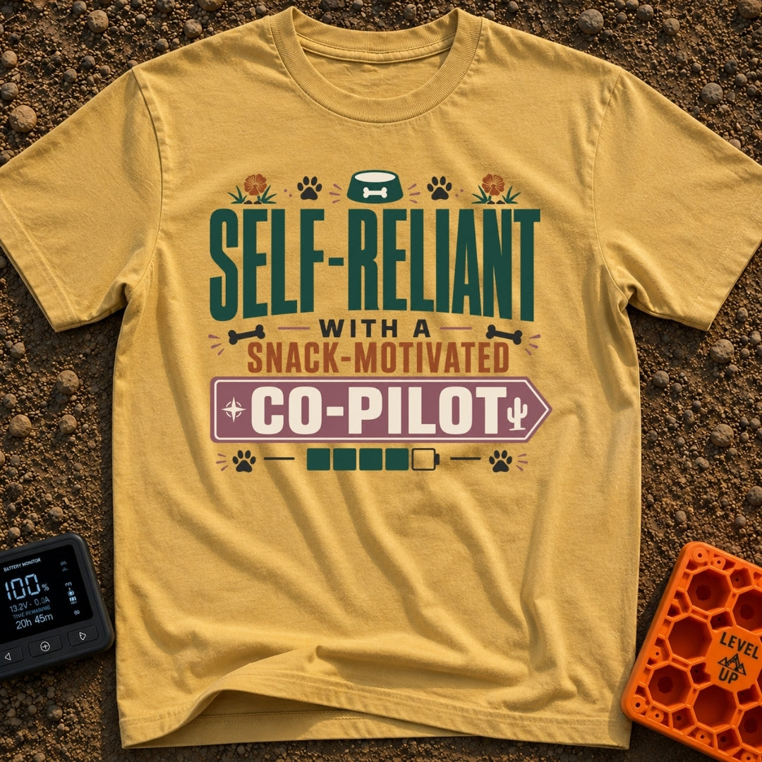 Snack Motivated Co Pilot - T-Shirt in Mustard - Typographic design reading "SELF-RELIANT WITH A SNACK-MOTIVATED CO-PILOT"...