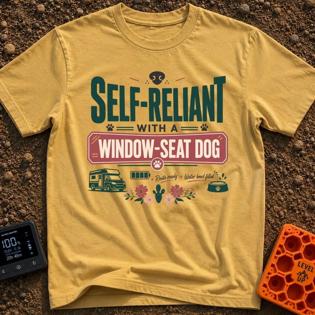 Window Seat Copilot - T-Shirt in Mustard - Typographic design reading 'SELF-RELIANT WITH A WINDOW-SEAT DOG' featuring...