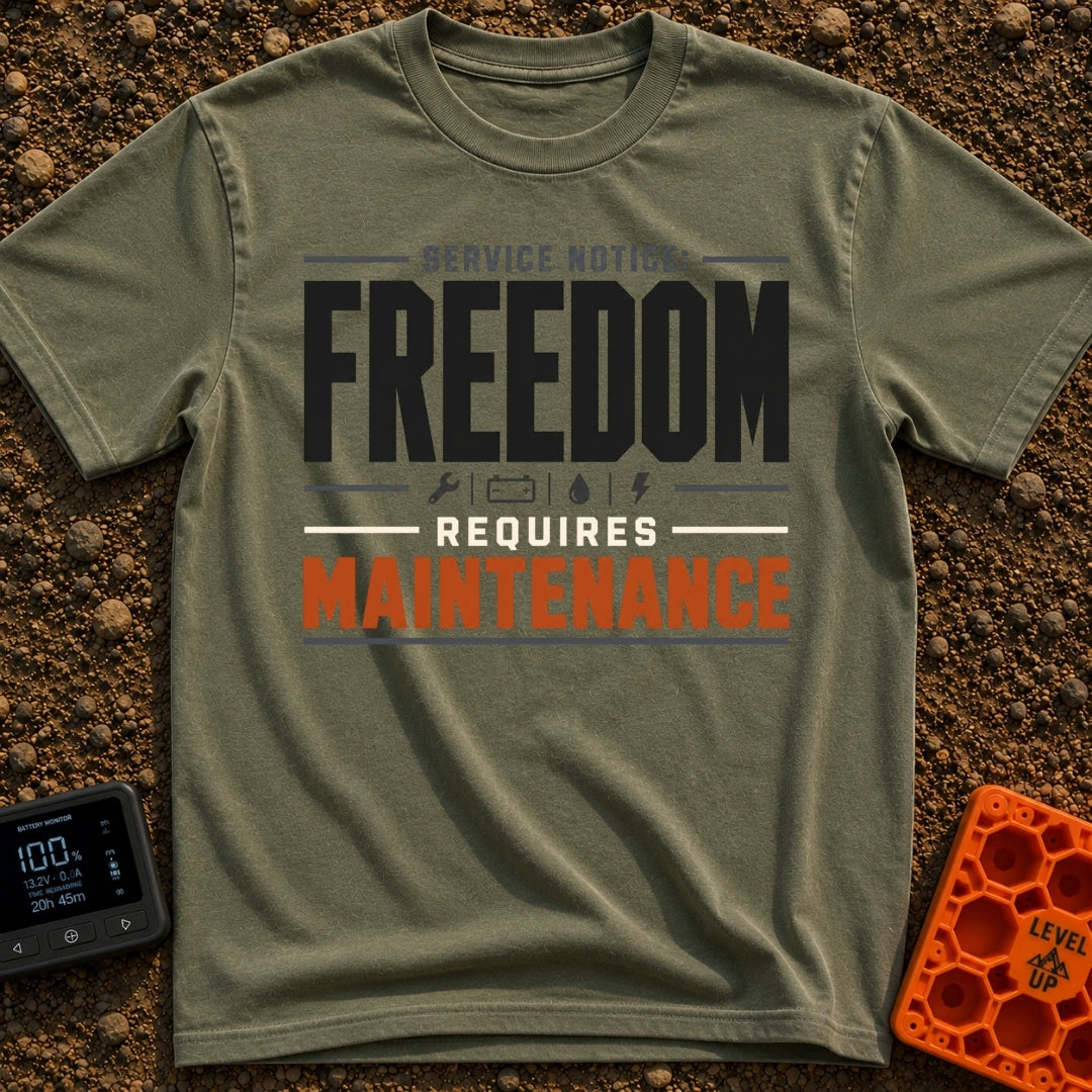 Freedom Requires Maintenance - T-Shirt in Moss - Text-based design reading "SERVICE NOTICE: FREEDOM REQUIRES MAINTENANCE"...