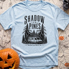 In The Pines - T-Shirt in Chambray - A black and white illustration of a camper van with a large roof-mounted solar array...