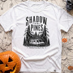 In The Pines - T-Shirt in White - A black and white illustration of a camper van with a large roof-mounted solar array...