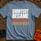 Shortcut to Growth - T-Shirt in Blue Jean - A text-based design featuring the phrase 'SHORTCUT BECAME' in faint white...