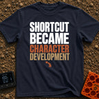 Shortcut to Growth - T-Shirt in Navy - A text-based design featuring the phrase 'SHORTCUT BECAME' in faint white...