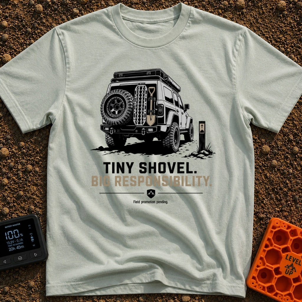 Dig Tiny Adventures - T-Shirt in Bay - A rear-view illustration of a rugged 4x4 off-road vehicle parked near a mountain...