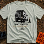 Dig Tiny Adventures - T-Shirt in Bay - A rear-view illustration of a rugged 4x4 off-road vehicle parked near a mountain...