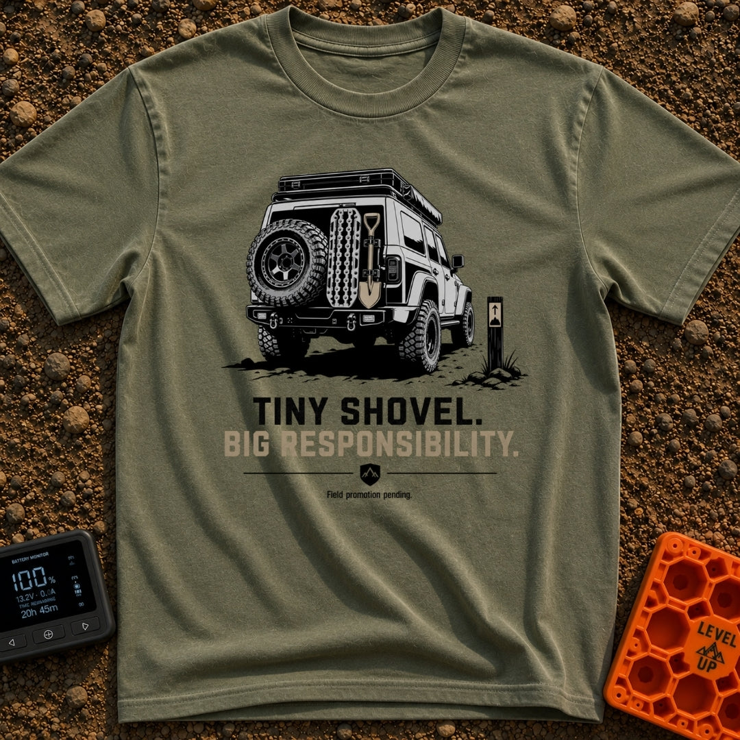 Dig Tiny Adventures - T-Shirt in Moss - A rear-view illustration of a rugged 4x4 off-road vehicle parked near a mountain...