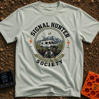 Views Over Bars - T-Shirt in Bay - A circular badge illustration showing a white camper van equipped with a roof-mounted...
