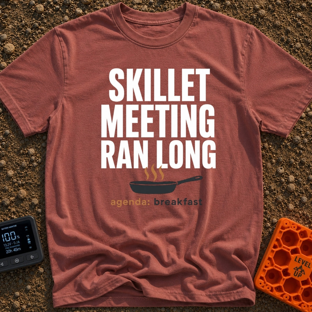 Skillet Meeting Ran Long - T-Shirt in Brick - Text reading "SKILLET MEETING RAN LONG" above an illustration of a black...