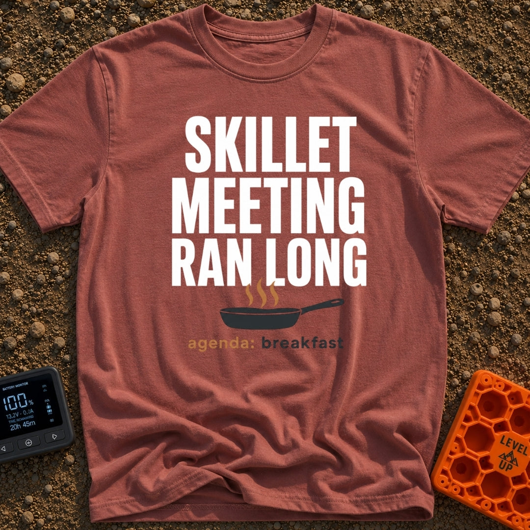 Skillet Meeting Ran Long - T-Shirt in Brick - Text reading "SKILLET MEETING RAN LONG" above an illustration of a black...