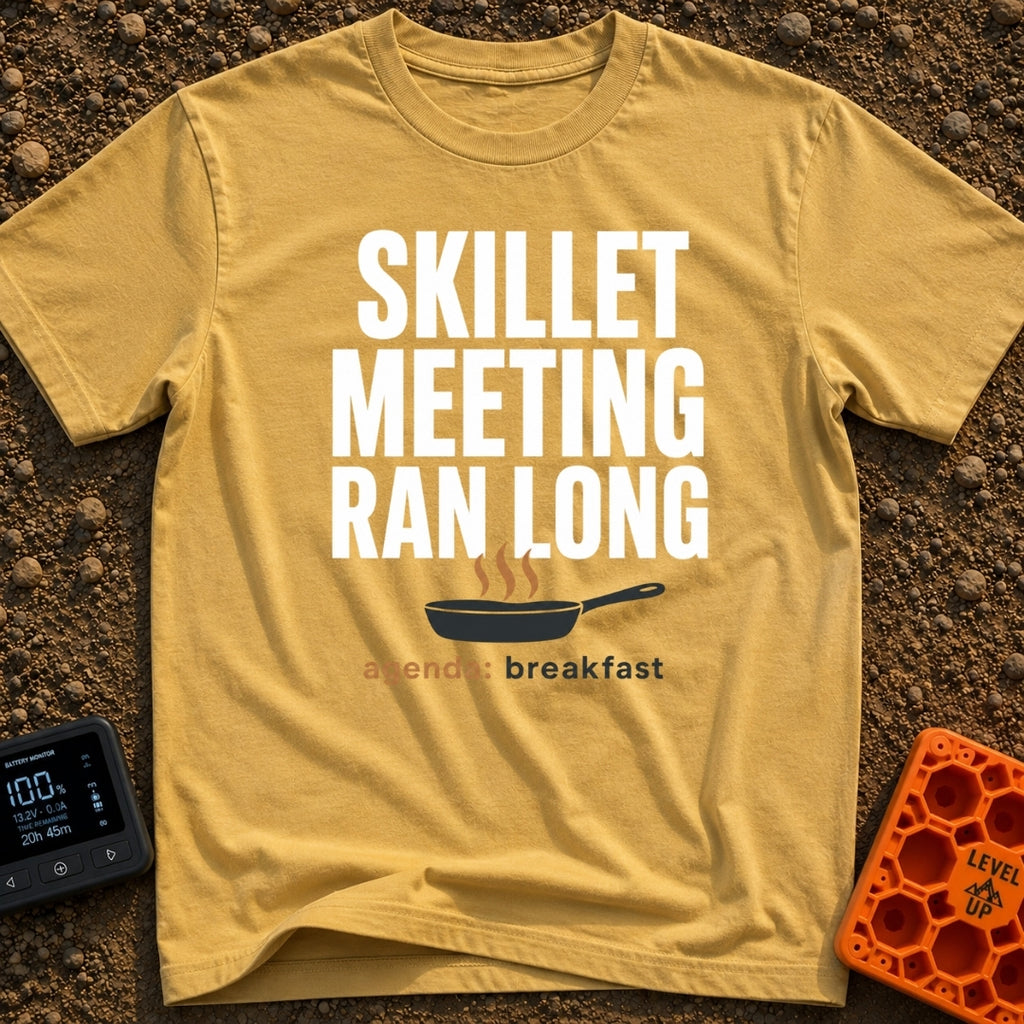 Skillet Meeting Ran Long - T-Shirt in Mustard - Text reading "SKILLET MEETING RAN LONG" above an illustration of a black...